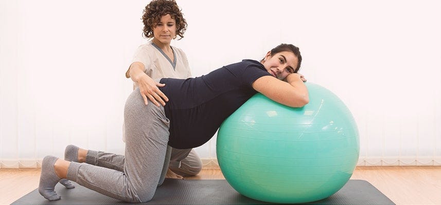 pregnant mom on birth ball doing exercise